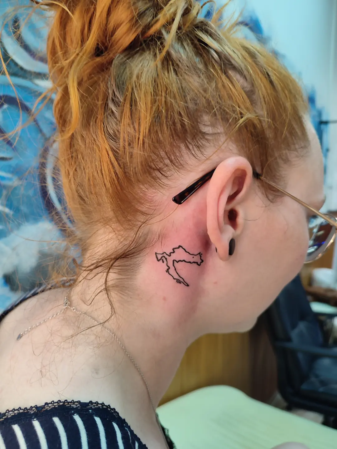 Delicate travel memento tattoo