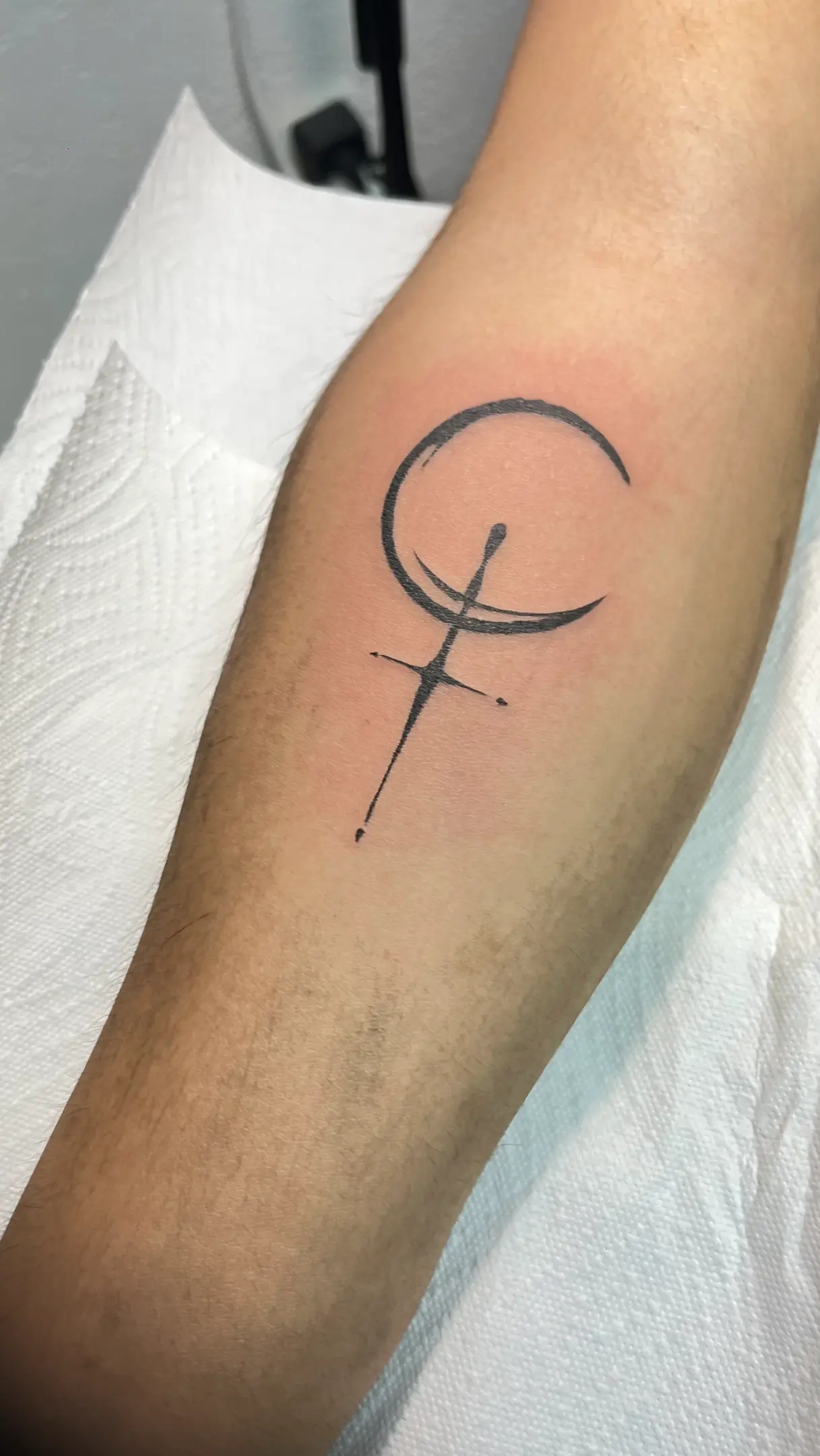 Subtle tattoo design on healed skin