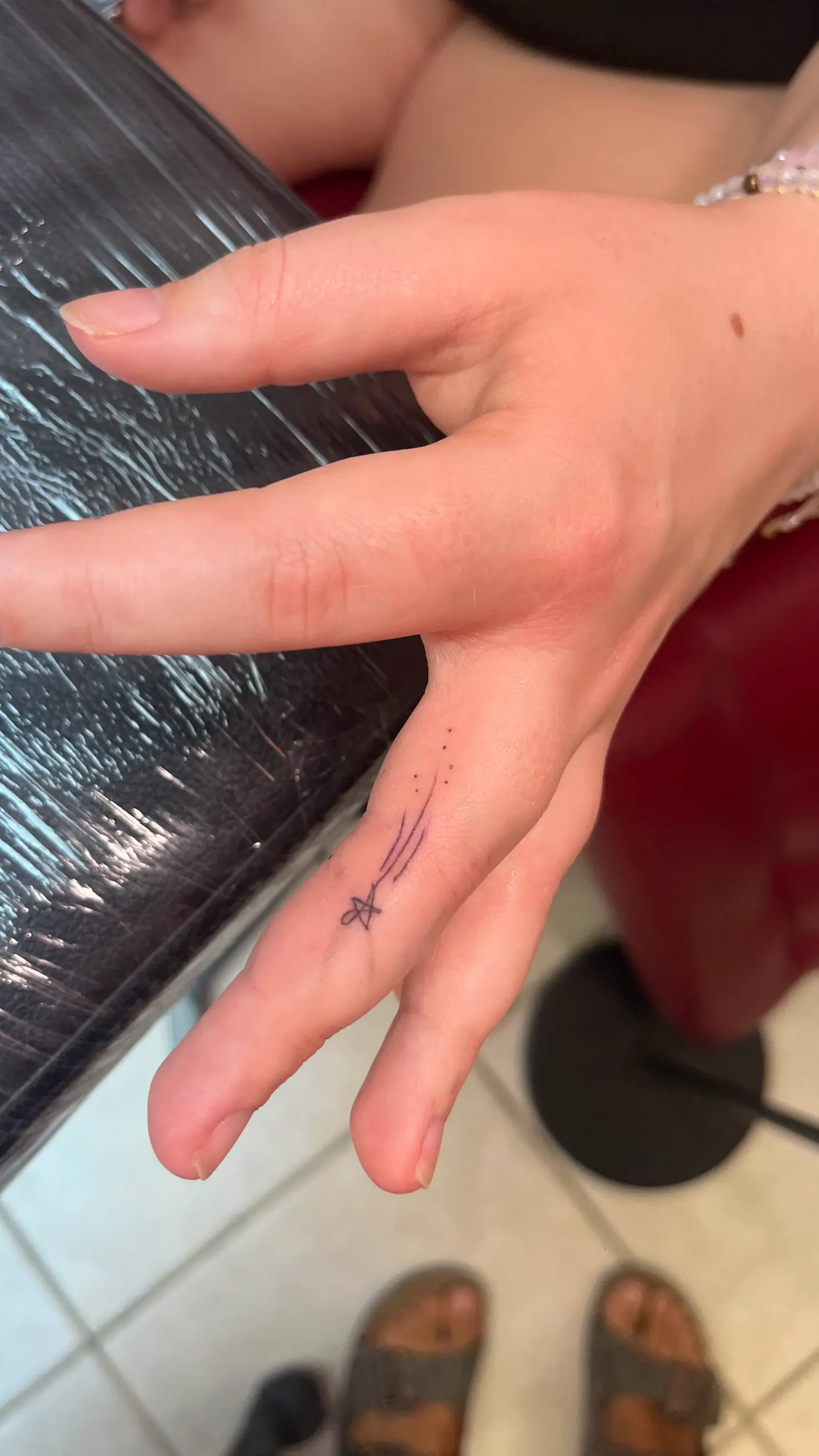 Delicate tattoo design healing near the beach